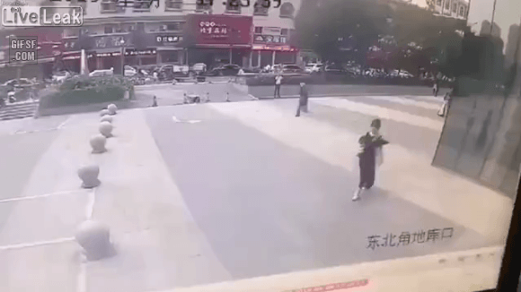 Woman killed by a falling object off a building.gif