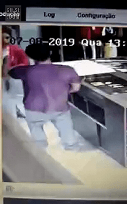 Woman is beaten during a robbery.gif